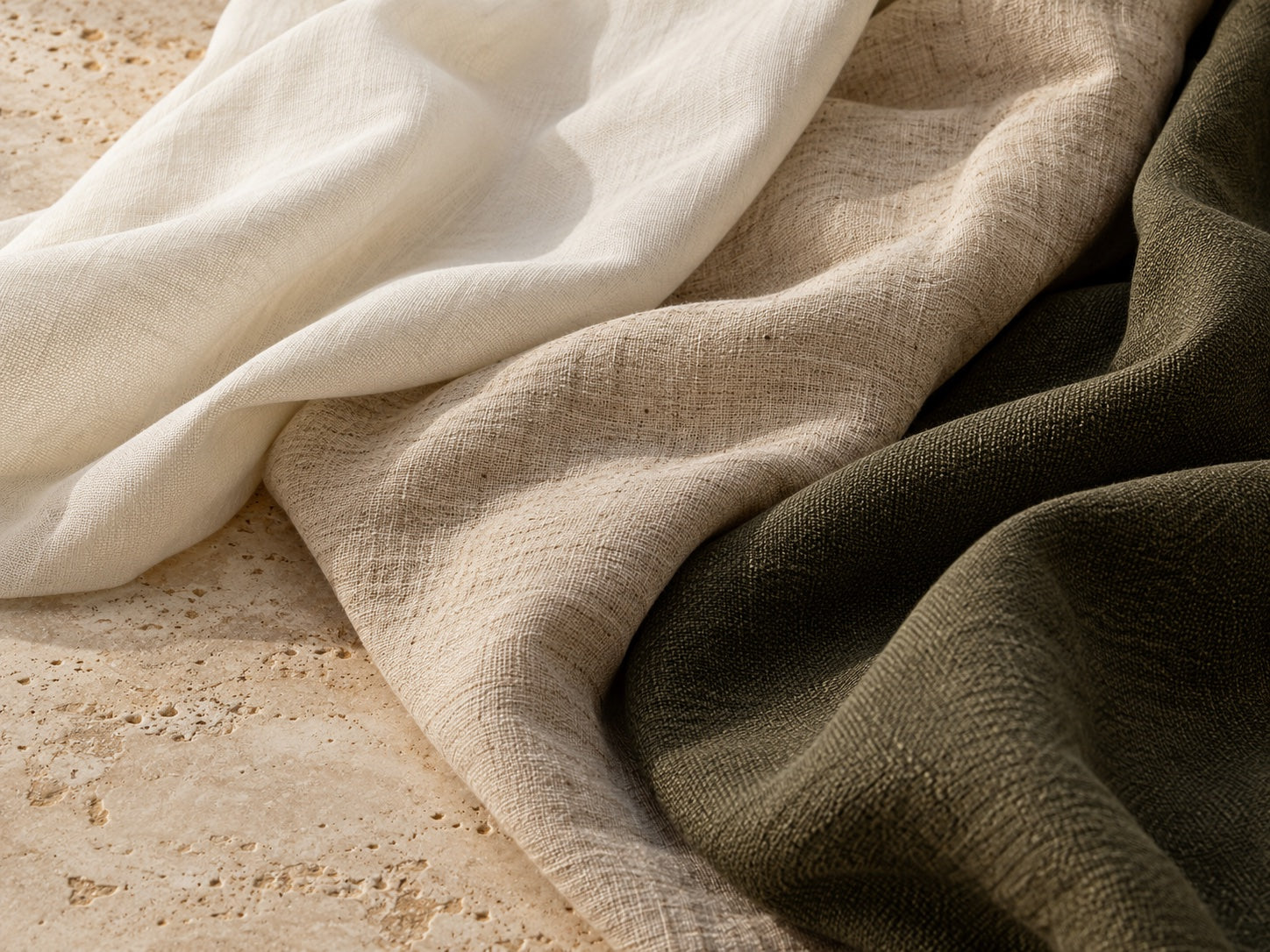 Editorial fabric textures in ivory, oatmeal, and olive